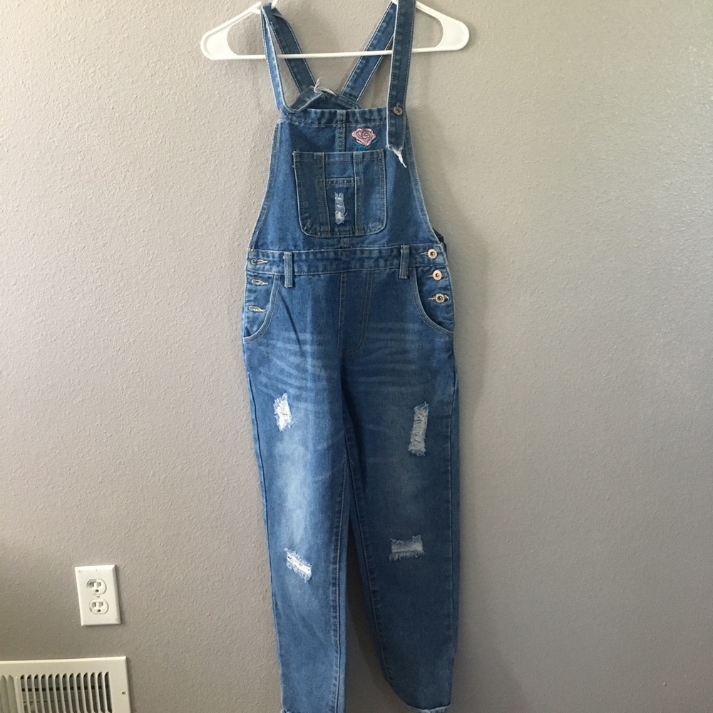 ripped jean overalls